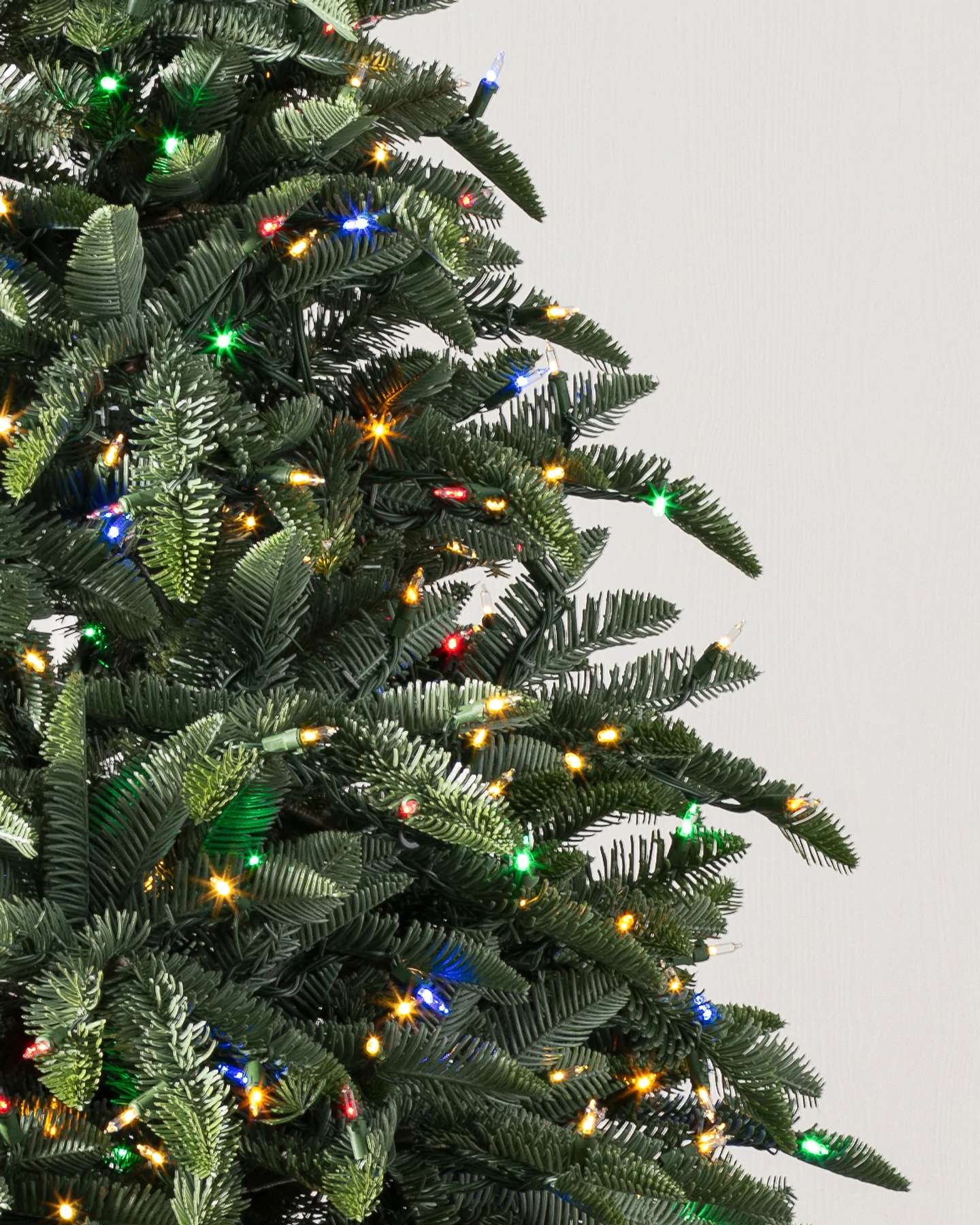 Balsam Hill Noble Fir Narrow Artificial Christmas Tree with LED Lights Close-Up of Realistic Branches