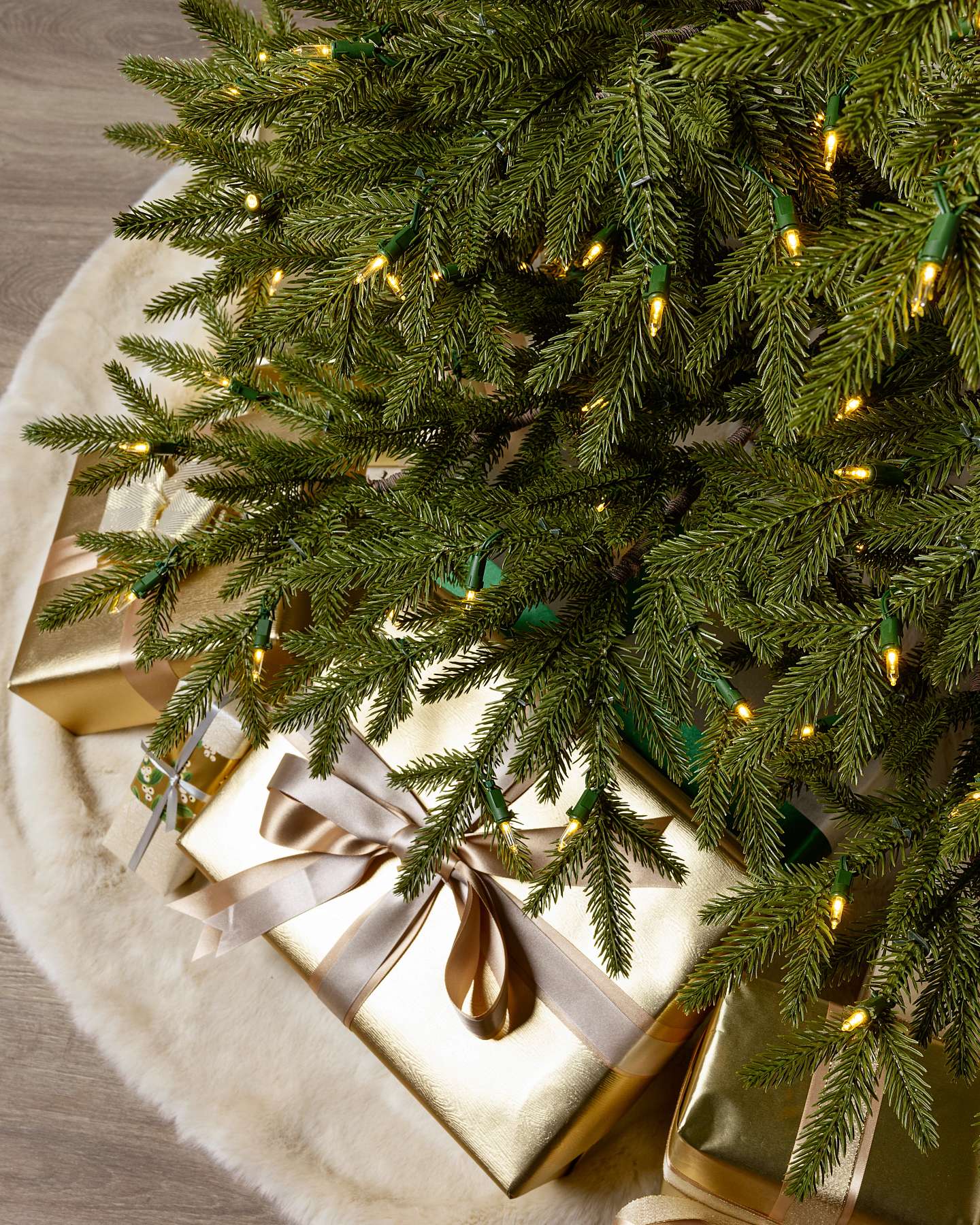 Balsam Hill Stratford Recycled Spruce Artificial Christmas Tree in a Cozy Living Room