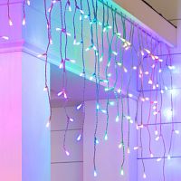 A string of multicolored curtain Christmas lights