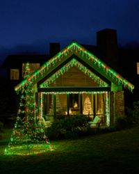A house decorated with Twinkly lights and Twinkly cone tree