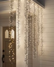 Porch decorated with waterfall Christmas lights