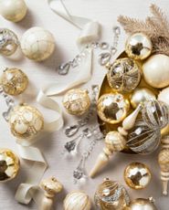 Assorted metallic silver, gold, and ivory Christmas baubles
