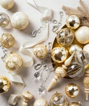 Art deco inspired gold and silver Christmas ornaments on a white background