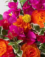 Closeup of orange and pink artificial flowers