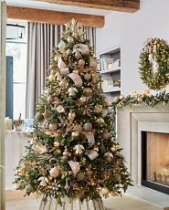  Christmas tree with burnished metal decorations in matte green and gold colors