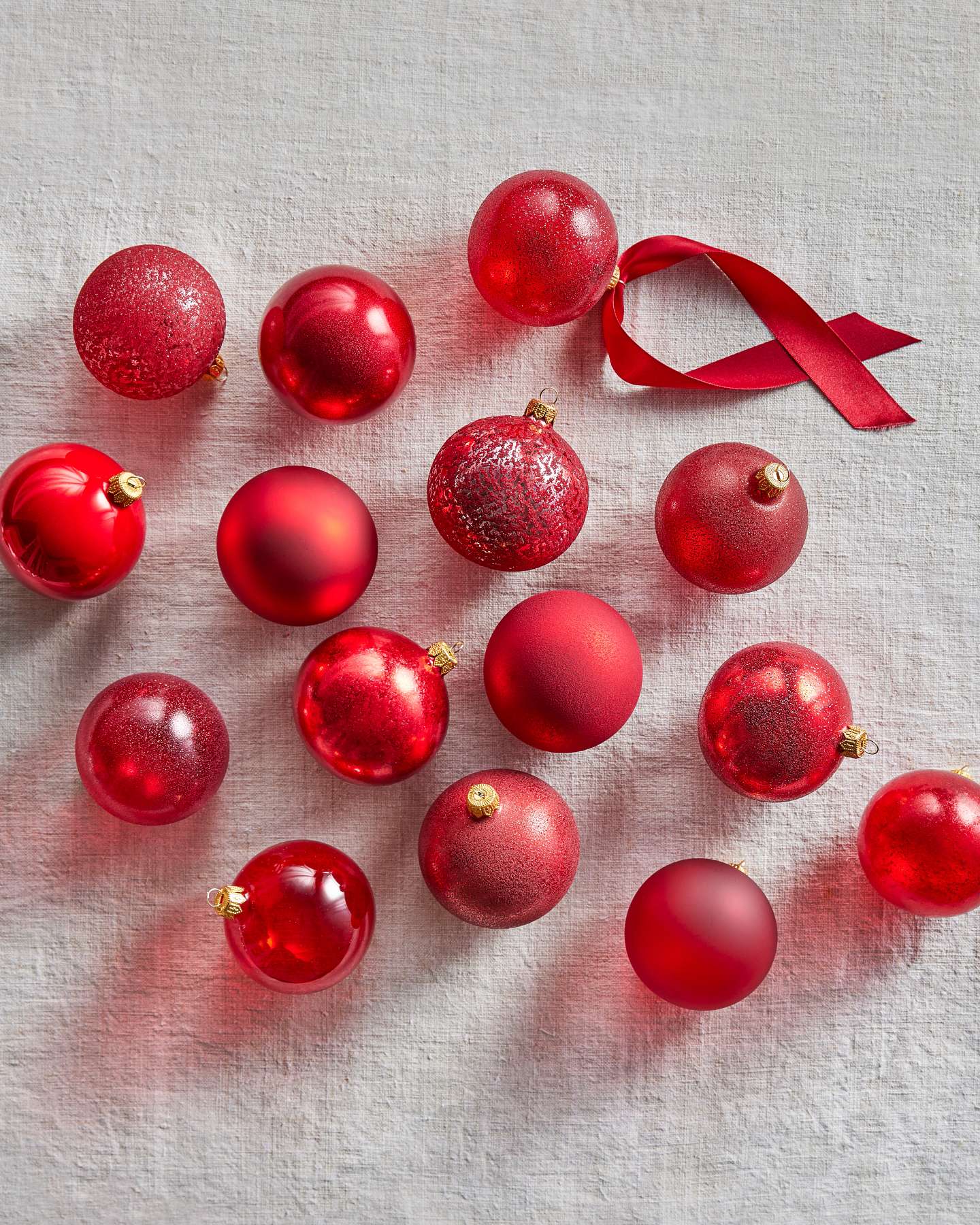 Balsam Hill Essentials Tonal Christmas Ornament Set Lifestyle Display with Red Ornaments