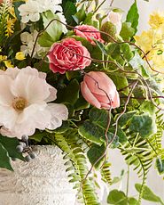 Closeup of artificial tulips and other flowers and foliage