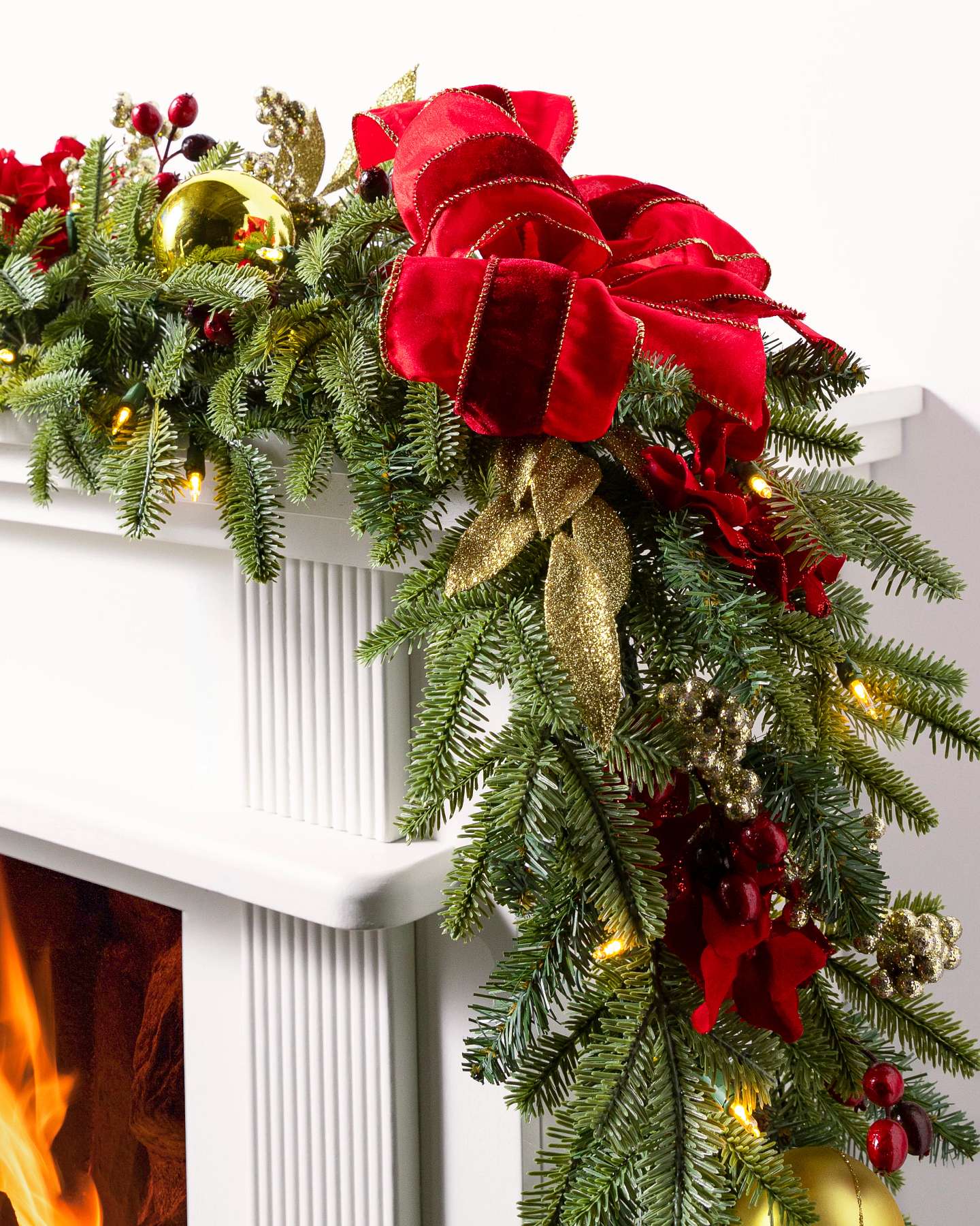Balsam Hill Holiday Traditions Fraser Fir Artificial Christmas Garland 10 Foot LED Clear on Fireplace