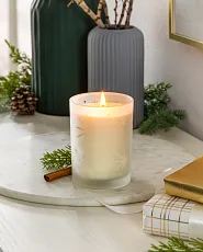Lit candle on marble tray