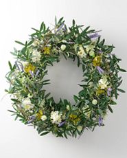 Artificial flower wreath with purple cattails, white lilacs, and thistle