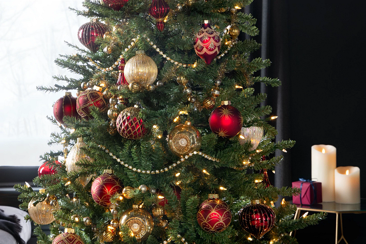 Artificial Christmas tree with red and gold decorations