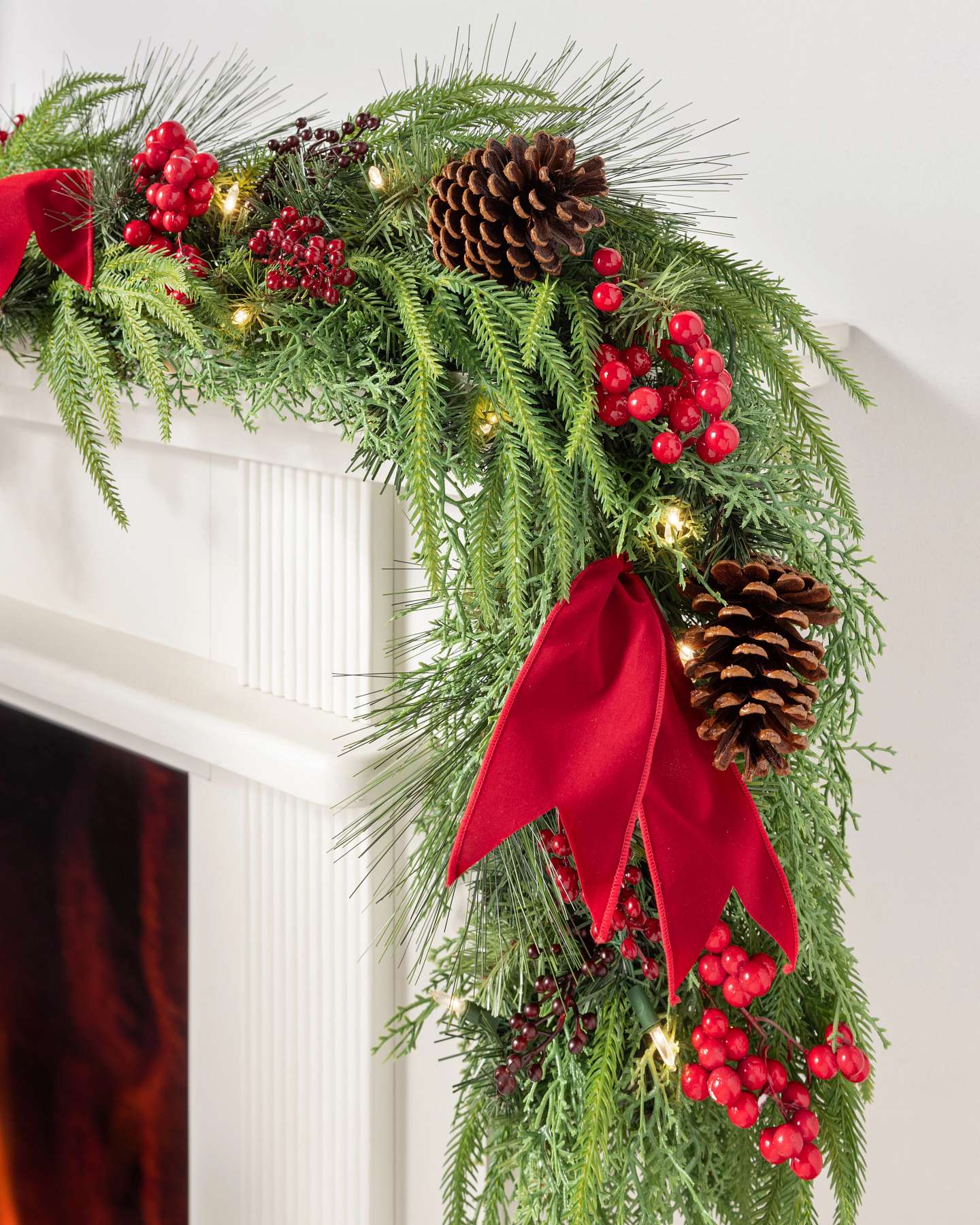 Balsam Hill Grand Heritage Artificial Christmas Garland On Top of a Fireplace