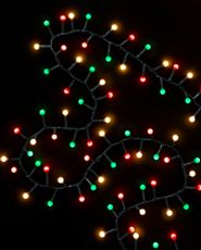 Multicolored Christmas light string on black background