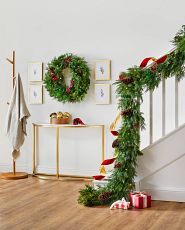 Artificial garland on staircase bannister