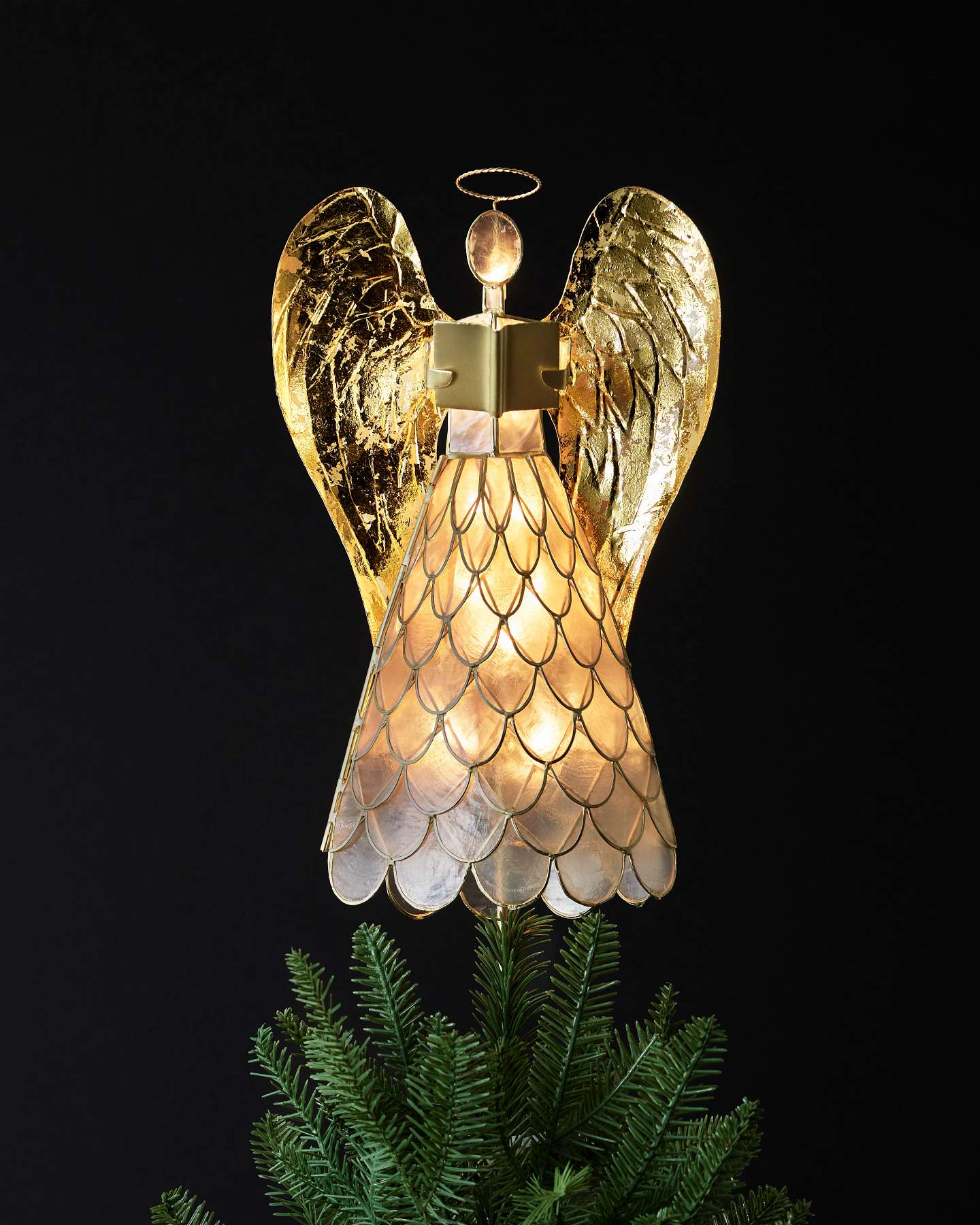 Balsam Hill Capiz Angel Lighted Christmas Tree Topper Lifestyle Display Closeup with Dark Background