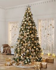 Christmas tree decorated with vintage-inspired gold and silver ornaments