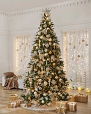 Christmas tree decorated with vintage-inspired gold and silver ornaments