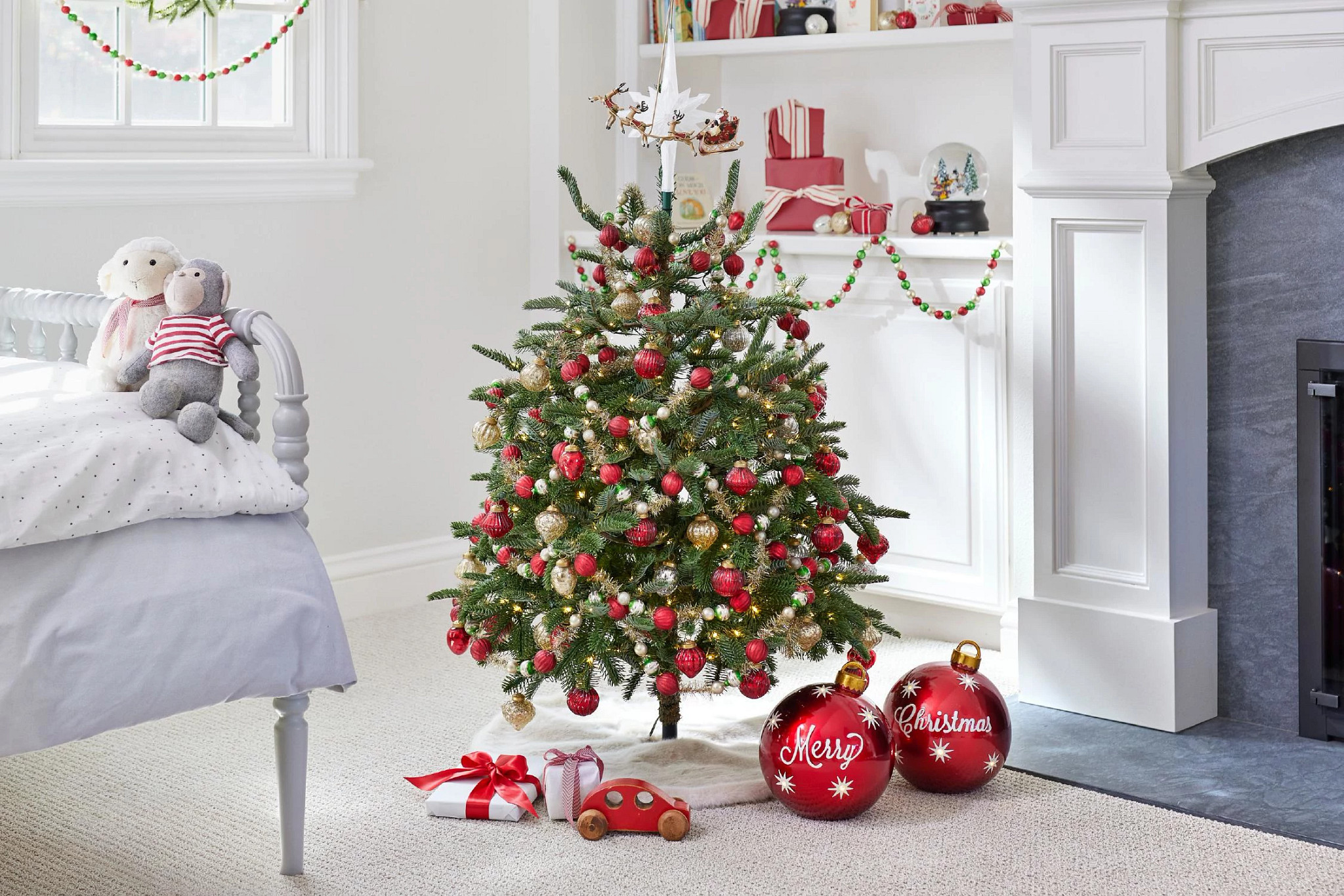  Decorated mini artificial Christmas tree in bedroom
