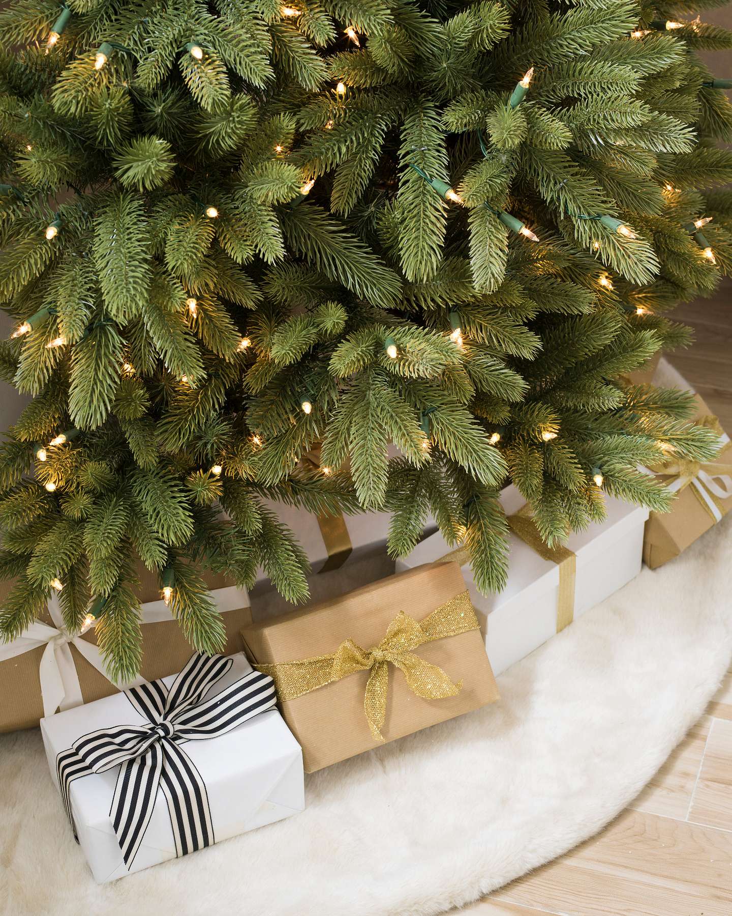 Balsam Hill Fifth Avenue Flatback Artificial Christmas Tree Lifestyle Display with Tree Skirt