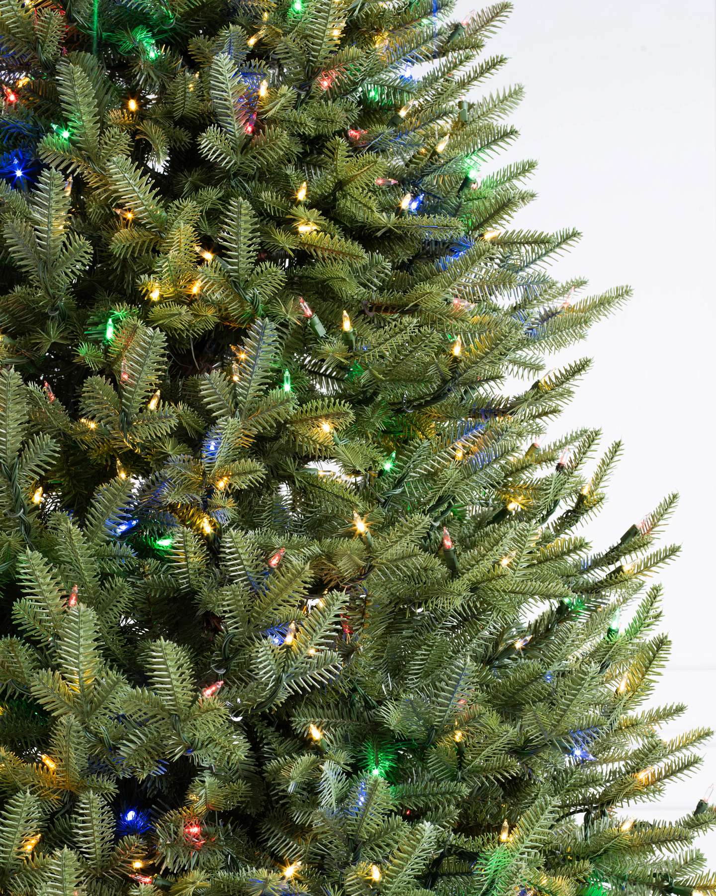 Balsam Hill Balsam Fir Narrow Artificial Christmas Tree Closeup with LED Color+Clear Lights Closeup