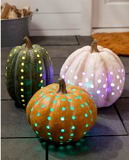 Pre-lit artificial pumpkins with dot cut-outs