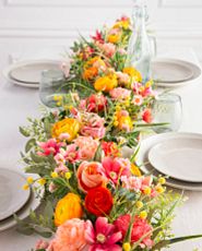 Artificial flower garland with cottage roses, ranunculus, peonies, billy buttons, cosmos, eucalyptus, and fern leaves