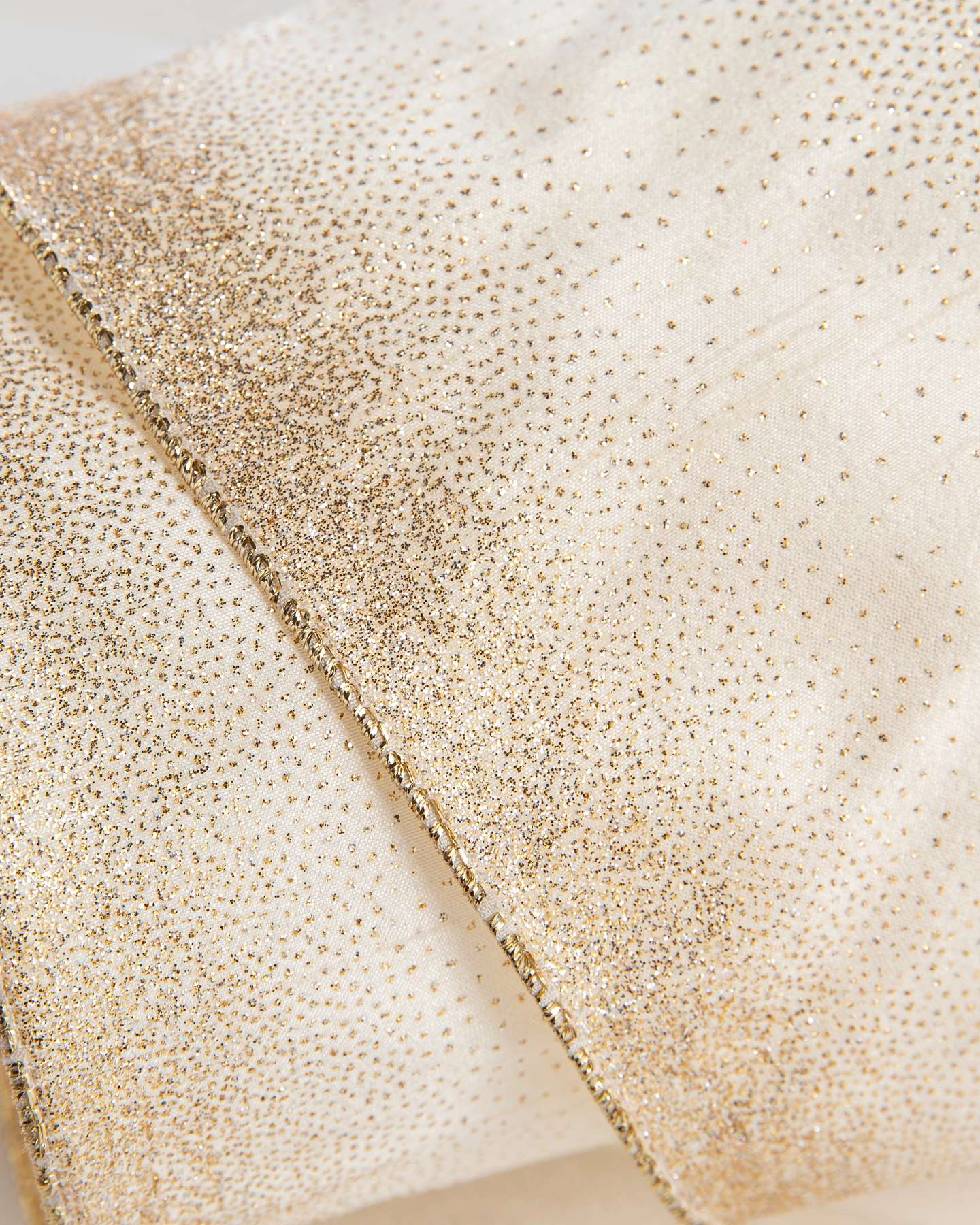 Balsam Hill Ivory and Gold Dupioni Artificial Christmas Tree Ribbon Closeup Highlighting Elegant Texture
