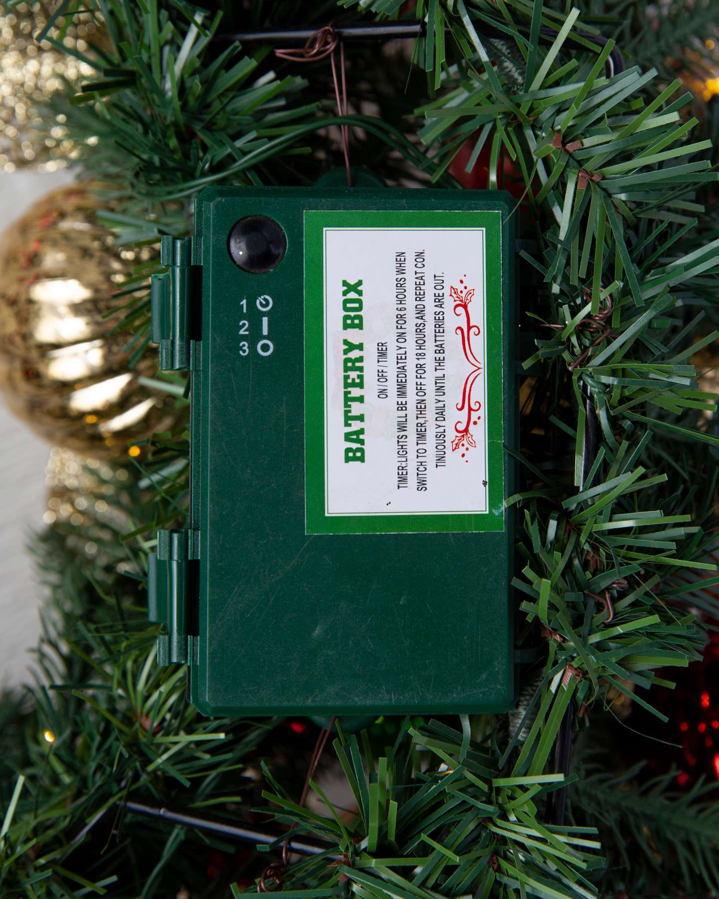 Balsam Hill Outdoor Merry and Bright Artificial Christmas Foliage Battery Compartment Feature