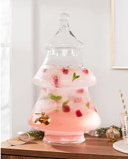 Christmas tree-shaped glass drink dispenser filled with fruit punch