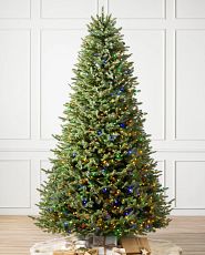 Pre-lit artificial Christmas tree with clear and multicolor LED lights