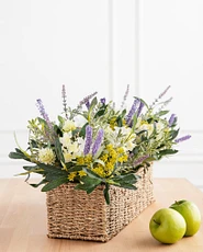 Spring flower arrangement in a wicker basket