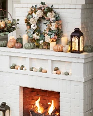 White brick fireplace with fall décor
