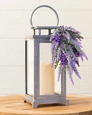 Lantern with candle and artificial lavender
