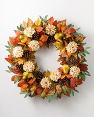 Fall wreath made with artificial pears, pinecones, and dahlias