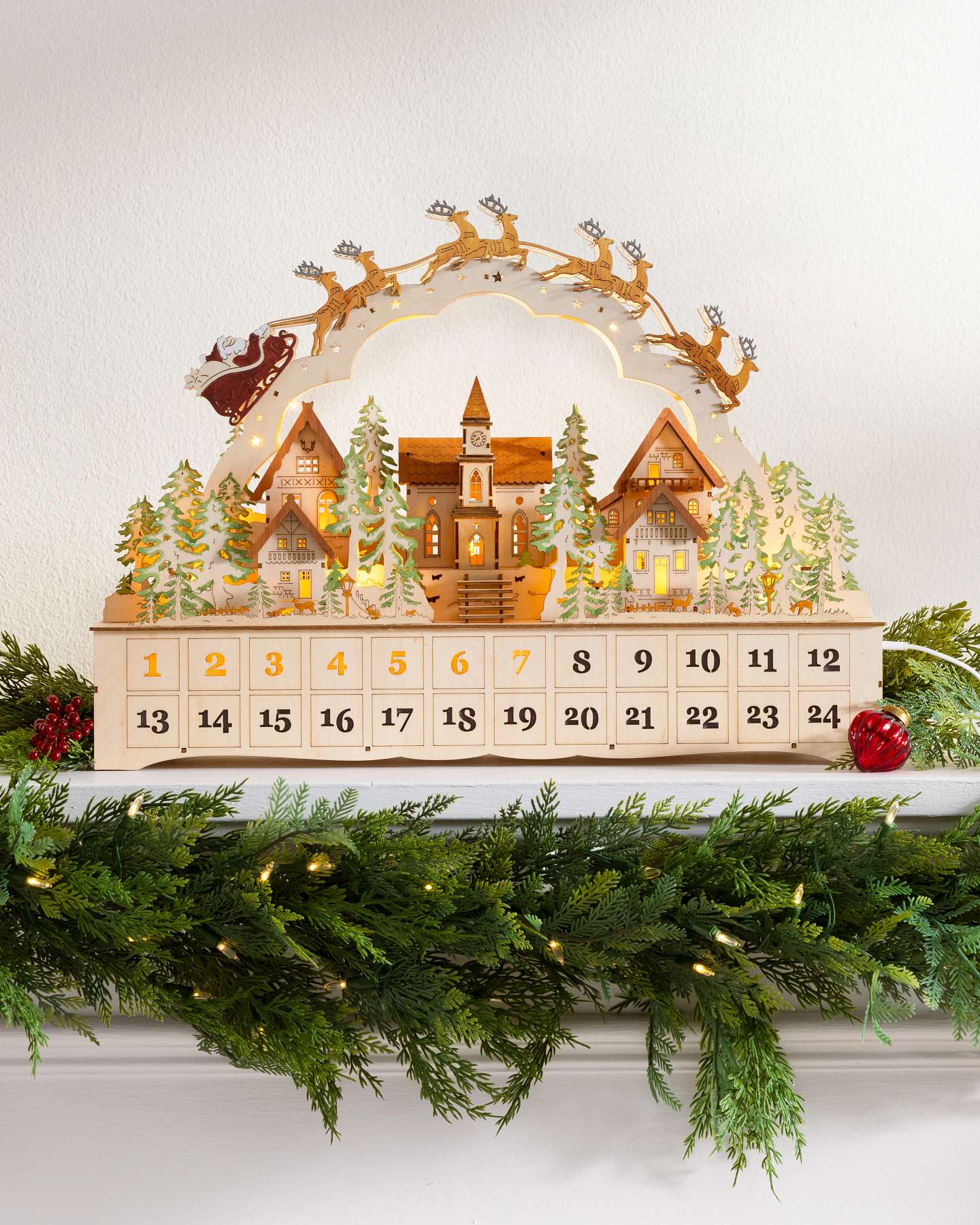 Balsam Hill Lit Wooden Santa Express Village Advent Calendar Displayed in Scene