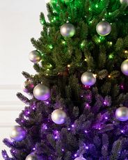 Closeup of artificial Christmas tree with color-changing lights