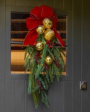 Holiday swag on wooden door