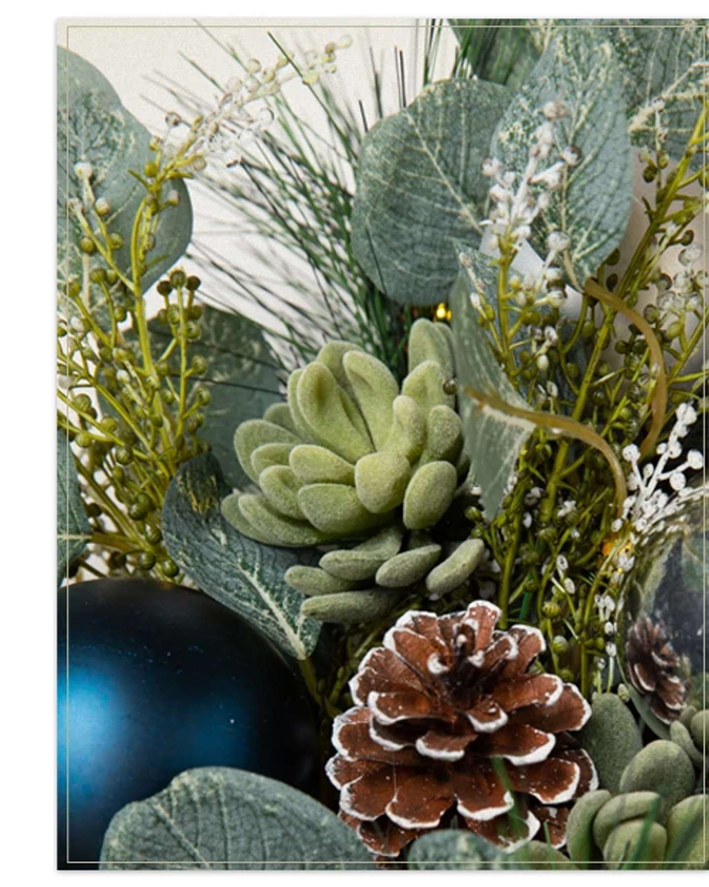 Balsam Hill Morning Frost Artificial Christmas Foliage in Product Display with Seasonal Detailing