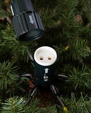 Close-up of artificial Christmas tree with Easy Plug poles