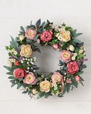 Artificial flower wreath with cottage roses, eucalyptus leaves, dock stems, and ivy leaves