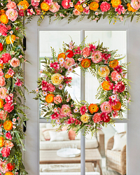 Glass door decorated with a flower wreath and garland