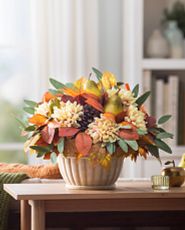 Artificial flower arrangement with dahlias, pinecones, and mixed leaves