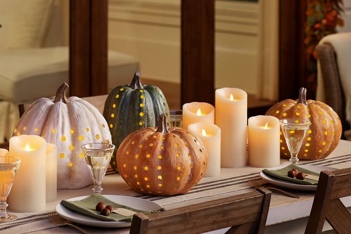 Thanksgiving decorations with pre-lit pumpkins and candles
