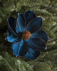 Closeup of artificial magnolia flower Christmas tree pick