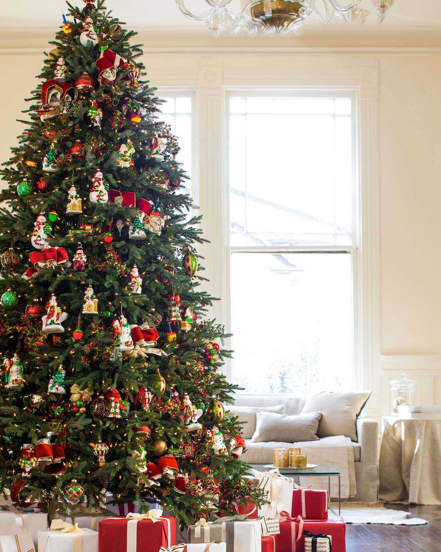 Balsam Hill Mistletoe and Holly Glass Christmas Ornaments Displayed in Elegant Tree Styling