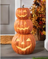 Stacked Jack-o’-Lanterns on front porch