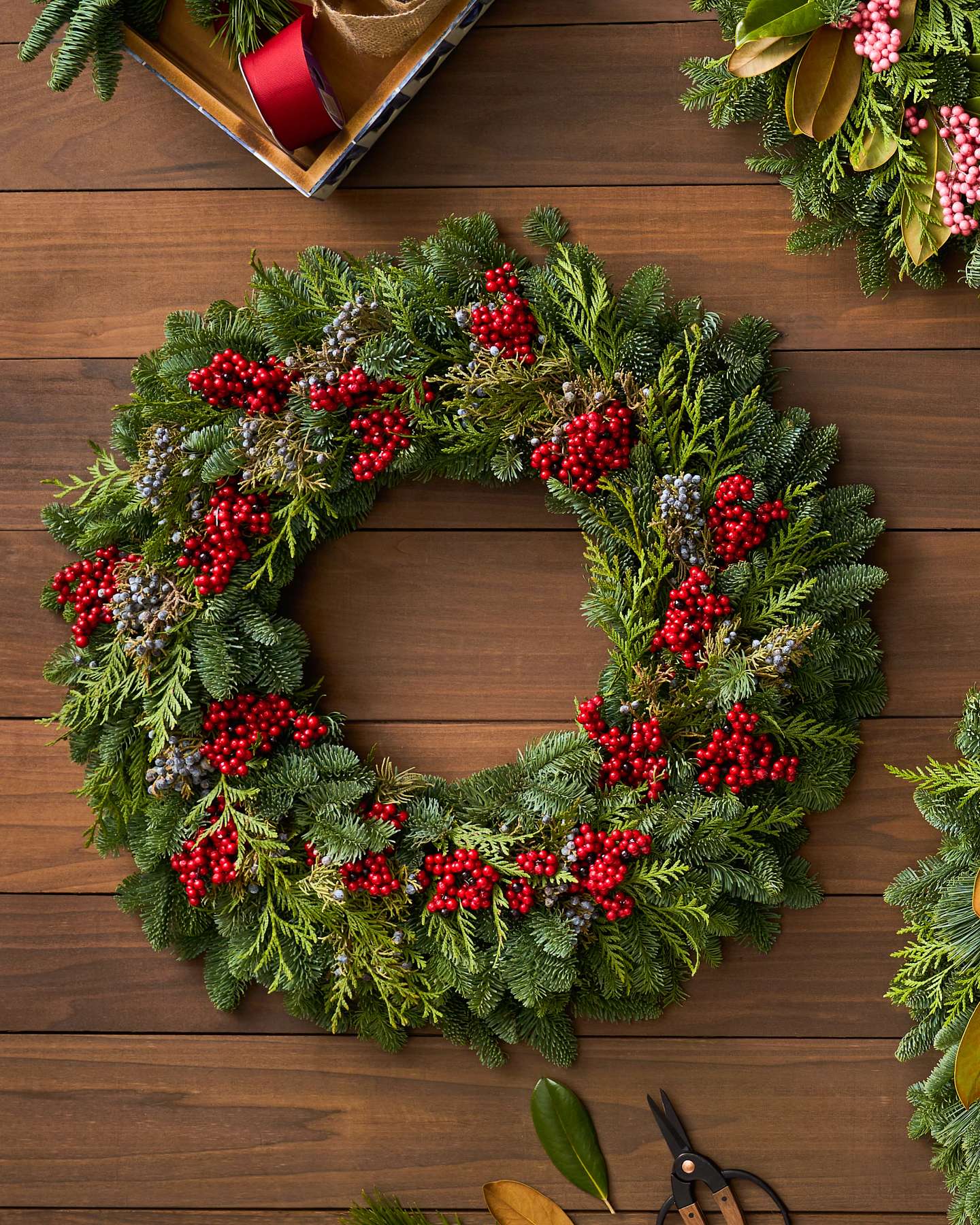 Balsam Hill Fresh Cedar Forest Artificial Christmas Garland 10-Foot Unlit Display with Wooden Background