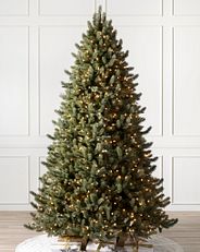 Vermont White Spruce artificial Christmas tree in a white room