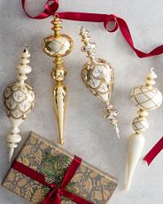 Finial Christmas ornaments in metallic gold and silver