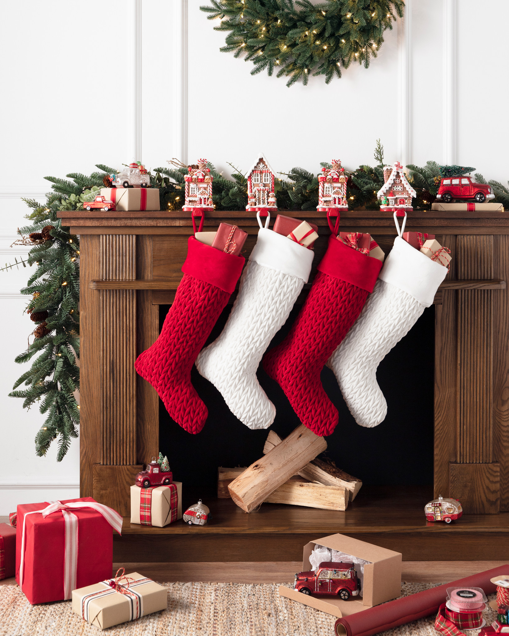  Mantel decorated with Christmas greenery and stockings